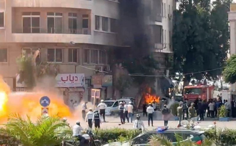 At least 18 dead as explosions hit Damascus during Macron's visit
