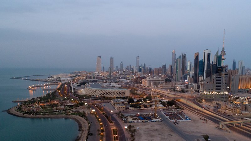 Kuwait says intercepted 2 Iranian missiles, 13 drones as shrapnel damages power lines