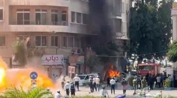 At least 18 dead as explosions hit Damascus during Macron's visit