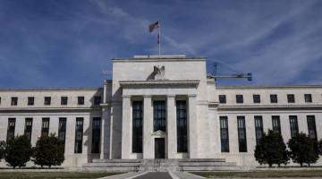 Fed keeps interest rates unchanged in split decision